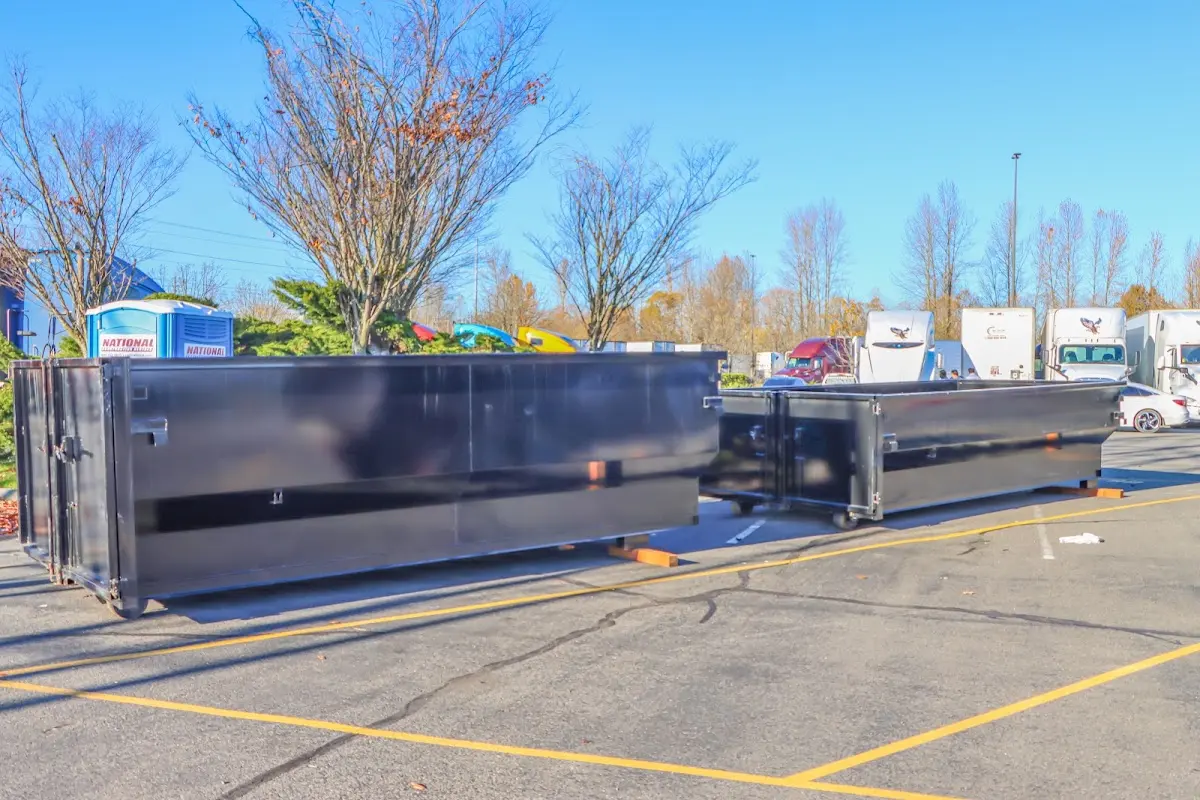 Professional dumpster rental service with roll-off container on residential driveway in LaGrange